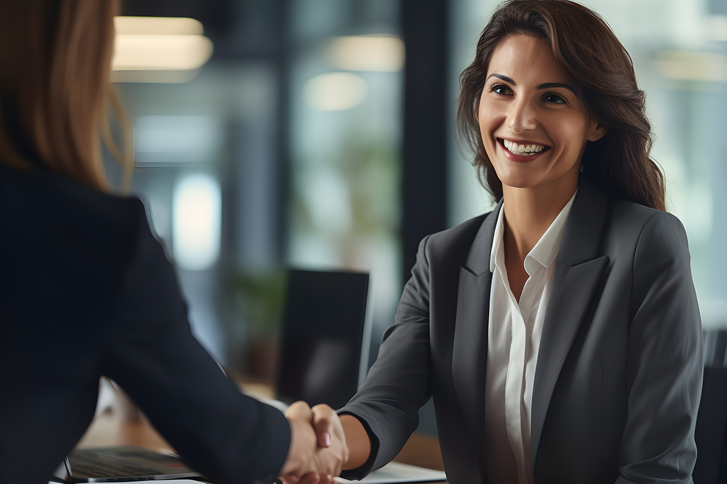 Businesswomen shaking hands